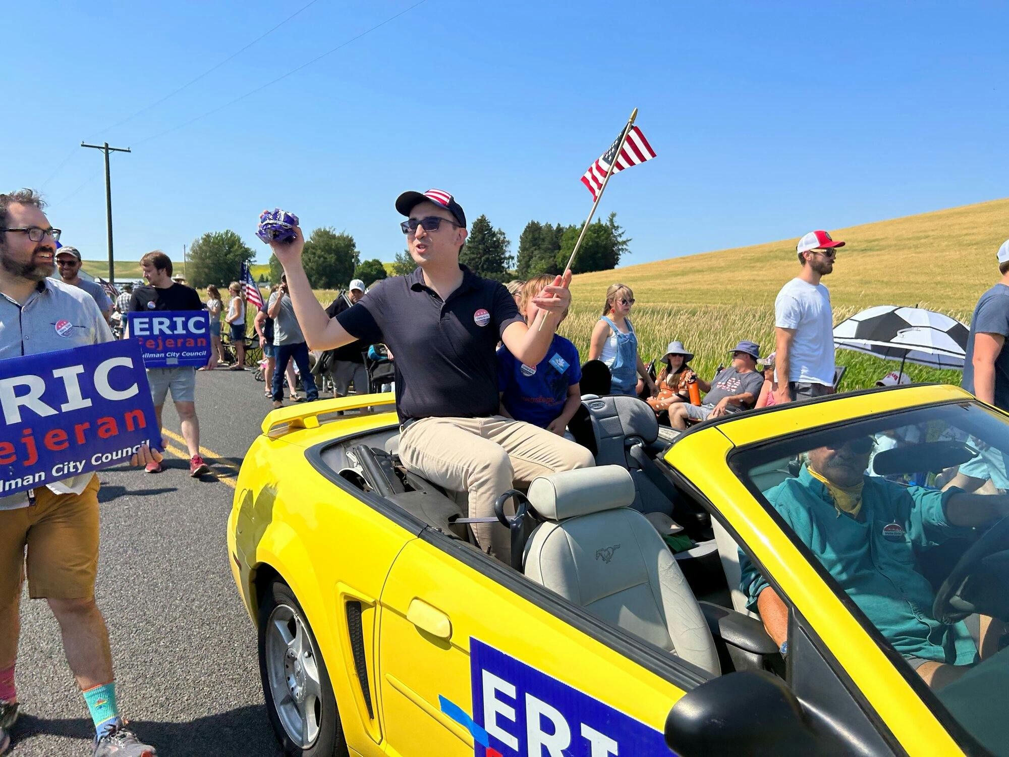 Eric Fejeran for Pullman City Council campaign participating in a 4th July parade.