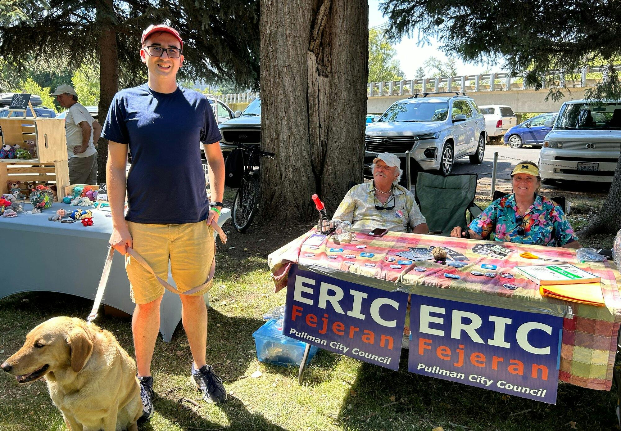 Eric Fejeran at the Palouse Music Festival with Bridget, the golden retriever mascot.